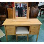 A contemporary light oak dressing table,