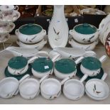 A Bourne Denby Greenwheat pattern sauce tureen and cover on stand, vegetable dishes,