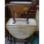 A 19th century oak gateleg dining table, elliptical top with fall leaves, turned legs,