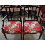 A pair of Edwardian satinwood crossbanded mahogany open armchairs,