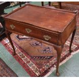 A 19th century Dutch mahogany bombe shaped silver table, shaped gallery above a long frieze drawer,
