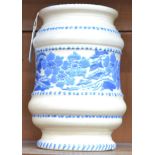 A Crown Ducal ribbed ovoid vase, in the manner of Charlotte Rhead, painted with blue flowers,