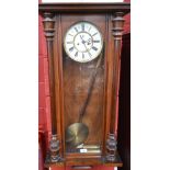 A 20th century mahogany cased Vienna type wall clock, 18cm dial with bold Roman numerals,