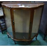 An early 20th century walnut display cabinet,