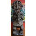 Tribal Art - a Mabila tadep figure, typically standing with legs crooked,