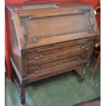 An early 20th century oak bureau,