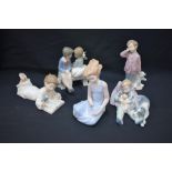 A Lladro figure, of a sleeping child with an armful of puppies, T96LR; other Lladro figures,