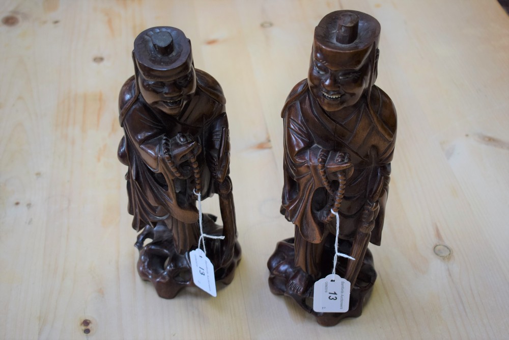 A pair of carved Chinese hardwood figures, Monks,