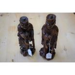 A pair of carved Chinese hardwood figures, Monks,