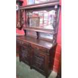 An Arts and Crafts style pine mirror-back sideboard,