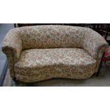 An early 20th century kidney shaped two-seat sofa,