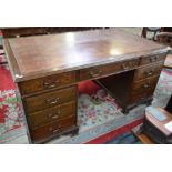 A 20th century oak writing desk,