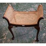 A 20th century mahogany framed stool, scroll end supports, woven cane seat, cabriole legs, pad feet,