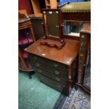 A 20th century mahogany chest of four long drawers,