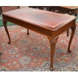 A George II style writing table, 137.