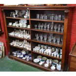 A Victorian walnut open library bookcase, moulded rectangular top above two rows of shelves,