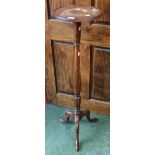 A 19th century mahogany candle/jardiniere stand, dished circular top, turned column, triform base,