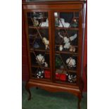 A 20th century mahogany display cabinet,