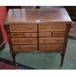 An Edwardian walnut and mahogany side cabinet,