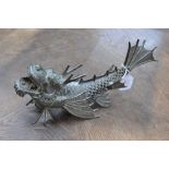 A 20th century bronze coloured metal Dragon Fish, modelled open mouthed, cast character marks, 32.