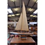 A large pond yacht, single-mast, varnished deck, white painted hull, 126cm long,