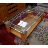 A contemporary glass-topped coffee table,