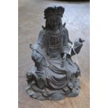 Asian School, modern, a bronzed figure, Guanyin, seated, 23.