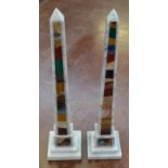 A pair of pietra dura library obelisks, each inlaid with an arrangement of malachite,