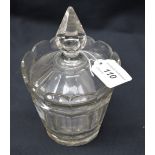 A 19th century multifaceted glass jar and cover,