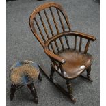 A 19th century elm child's rocking chair;