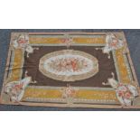 A woolwork, hand stitched table runner/carpet, in shades of green, ochre, brown and orange,