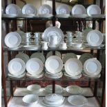 A Limoges plain white porcelain dinner service, for twelve, comprising dinner plates, salad plates,