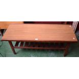 A mid-20th century retro teak coffee table, rectangular top above a planked undertier,