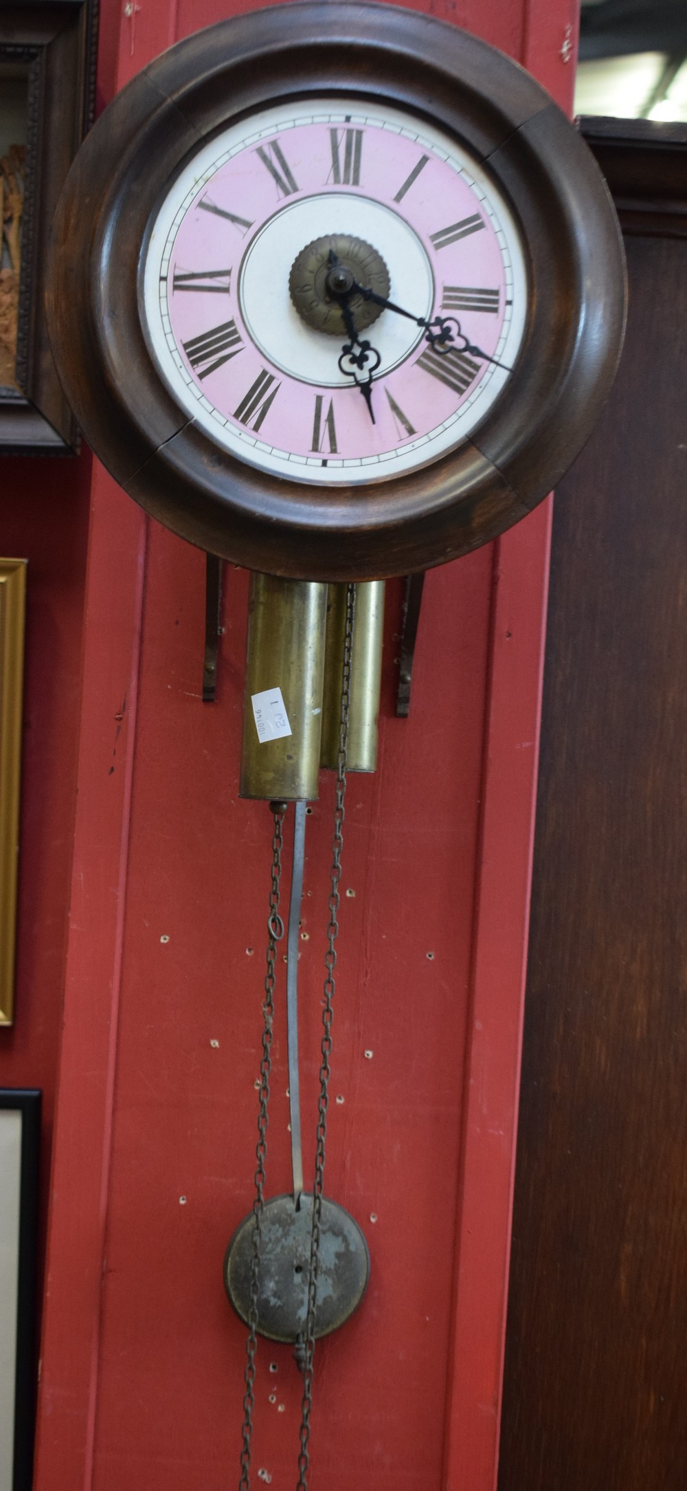 A 19th century circular 'postman's' alarm wall clock, with pendulum and weights, c.