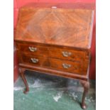 A 20th century walnut bureau,