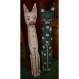 Tribal Art - a pair of large Indonesian softwood totems, as cats, picked out in colourful pigments,