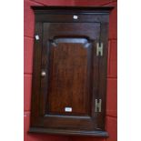 A 19th century oak corner cupboard, of small proportions,