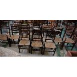A harlequin group of ten 19th century predominantly oak rush seated dining chairs,
