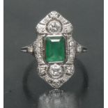 An emerald and diamond cluster ring, central rectangular emerald cut emeralds approx 1.