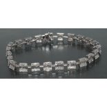 A contemporary certified fancy link diamond bracelet, box and razor bar body inset with,