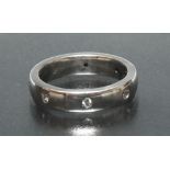 A contemporary platinum and diamond eternity ring,