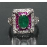 An Art Deco style emerald, ruby and diamond ring, central oval emerald approx 1.