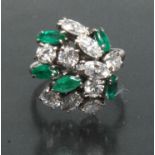 A bespoke diamond and emerald cluster ring,