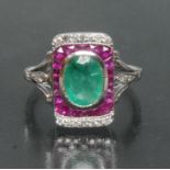 An Art Deco style emerald, ruby and diamond ring, central deep green oval emerald, approx 1.