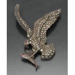 A mid 20th century silver marcasite encrusted Eagle catching a Fish brooch.