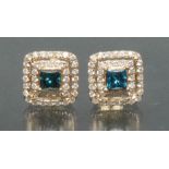 A pair of fancy blue and white diamond earrings,