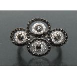 A contemporary certified fancy black and white diamond quartetto dress ring,