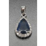 A banded blue sapphire and diamond pendant, central pear shaped blue banded sapphire, approx 3.