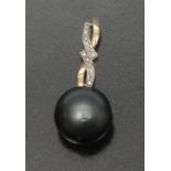 A Tahitian south sea cultured pearl and diamond pendant, large light grey globular pearl approx 15.