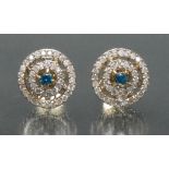A pair of fancy blue and white diamond target earrings,
